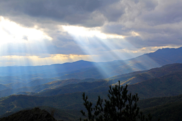 Sun rays mountains fall web